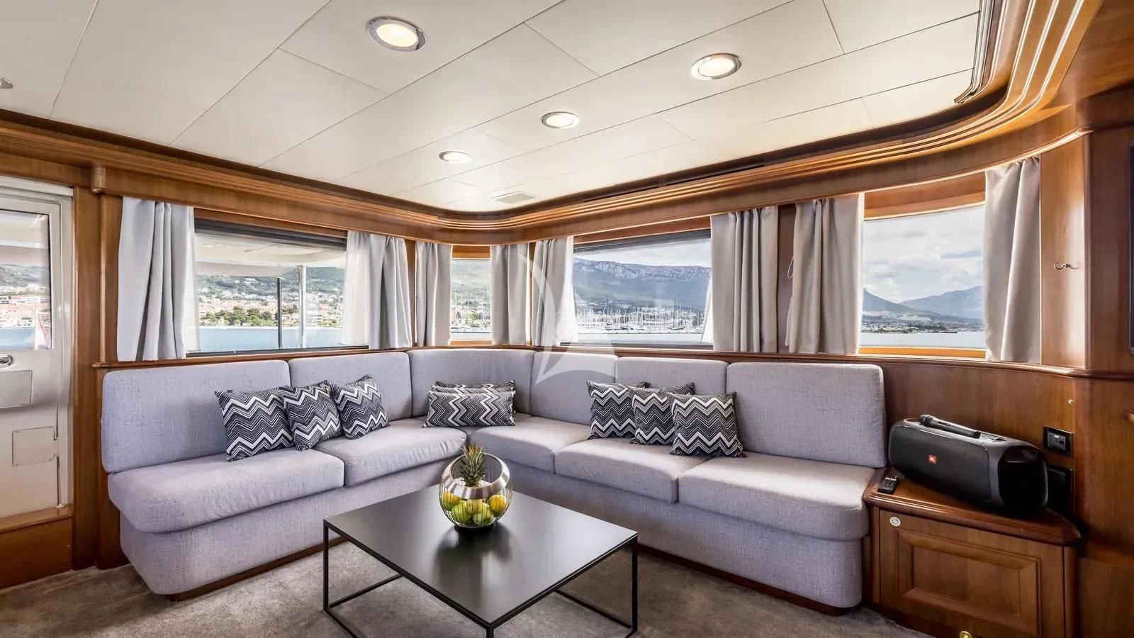 a living room with a couch and a coffee table aboard KLOBUK Yacht for Charter