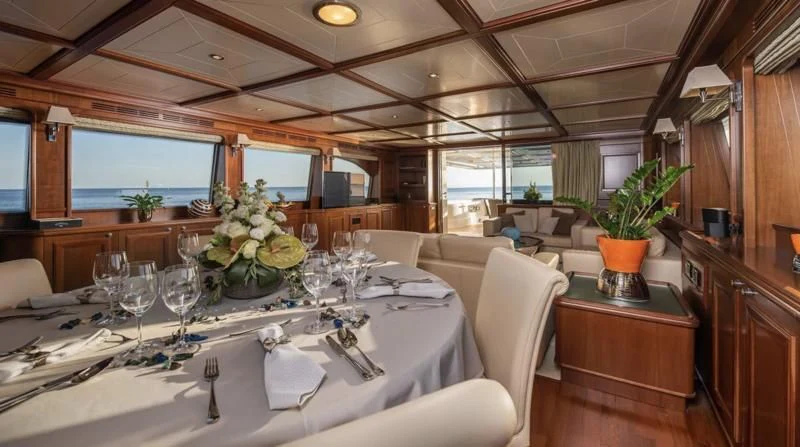 a large dining room with a large table and chairs aboard KLOBUK Yacht for Charter