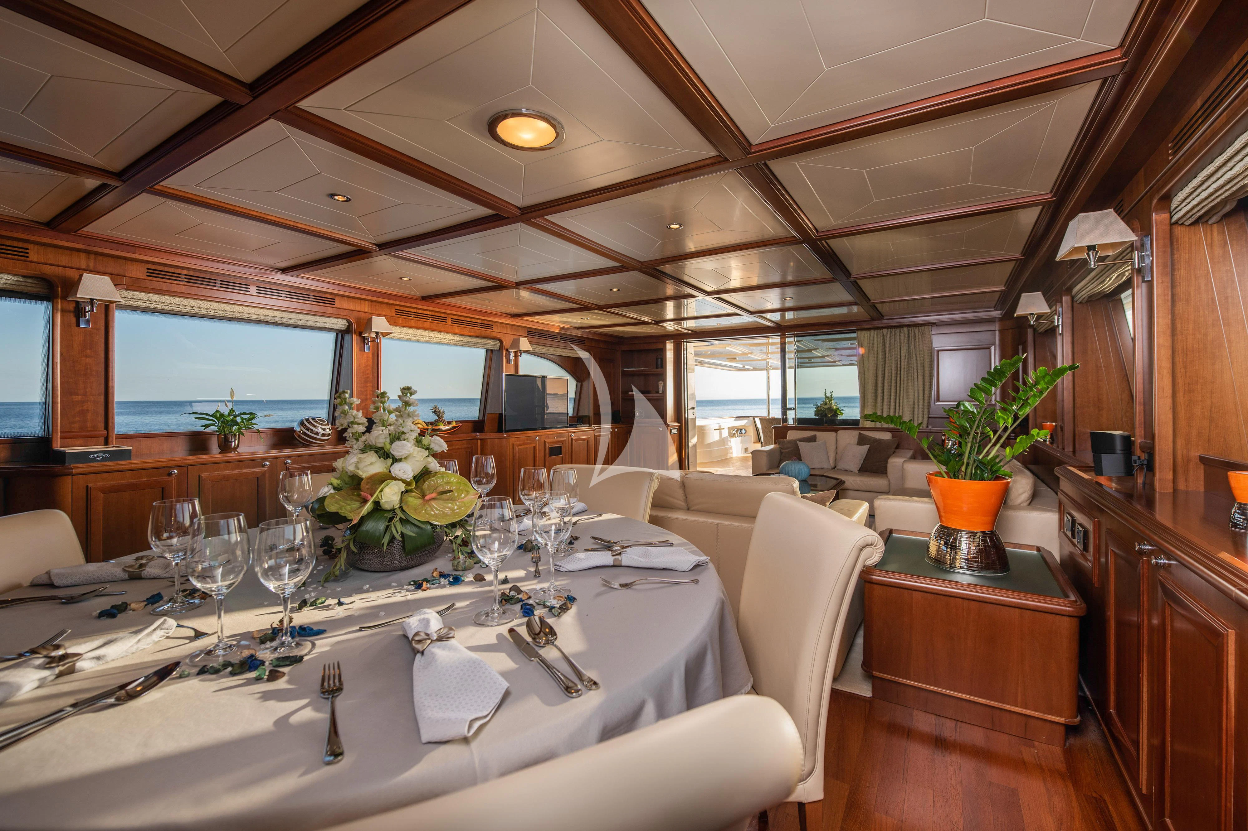 a dining room with a large table aboard KLOBUK Yacht for Charter