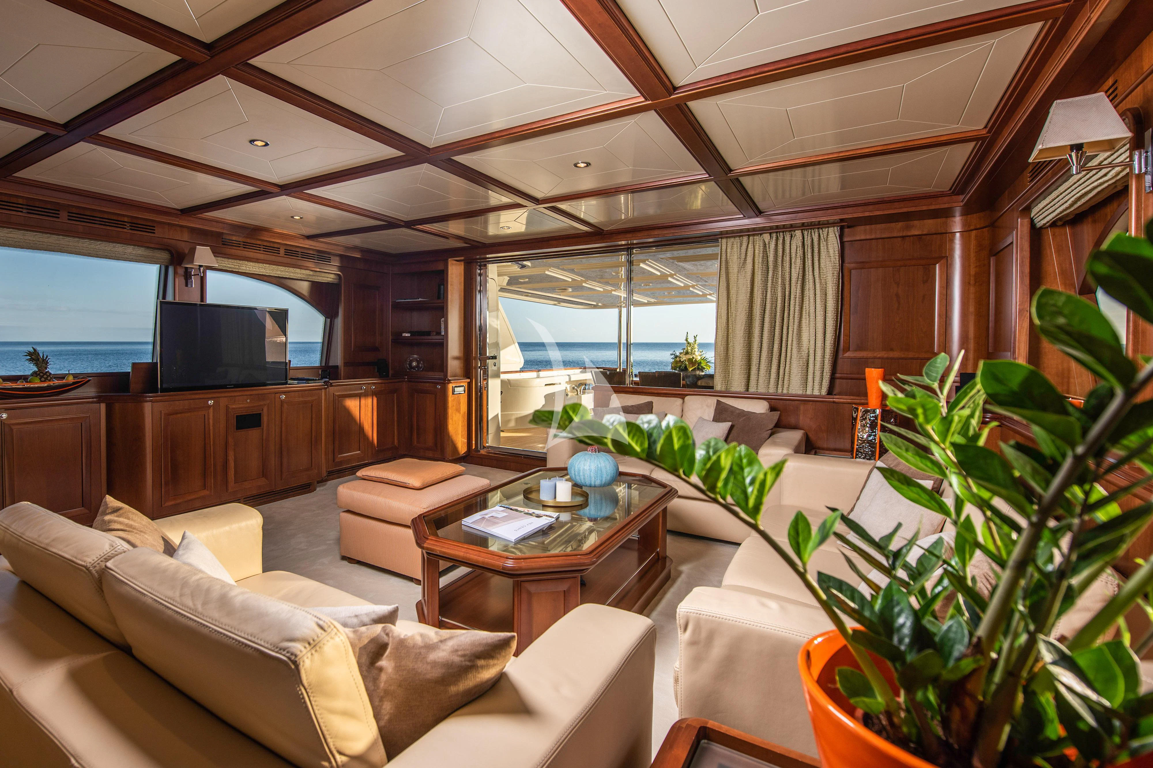 a living room with a large window aboard KLOBUK Yacht for Charter