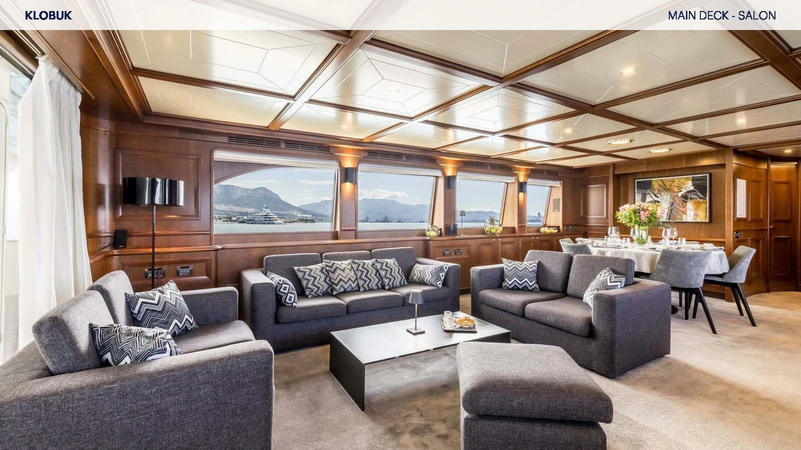 a living room with a couch and a table aboard KLOBUK Yacht for Charter