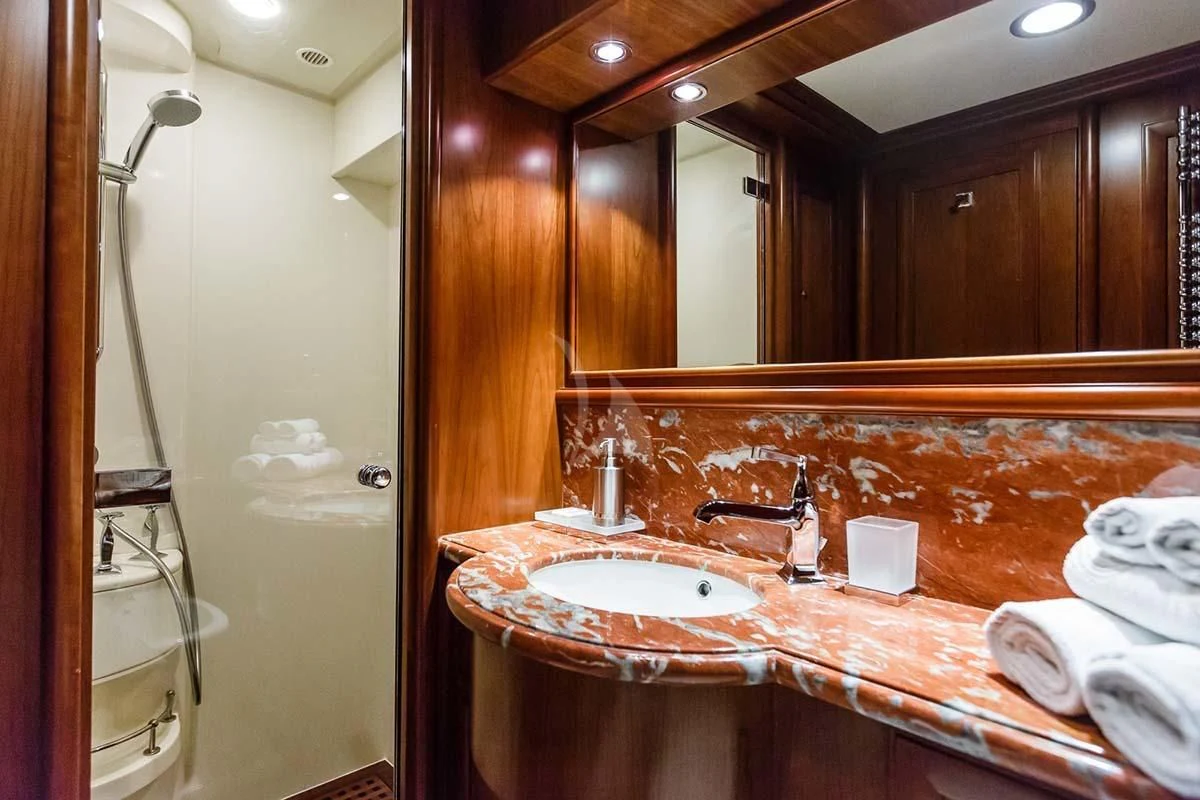 a bathroom with a large mirror aboard KLOBUK Yacht for Charter