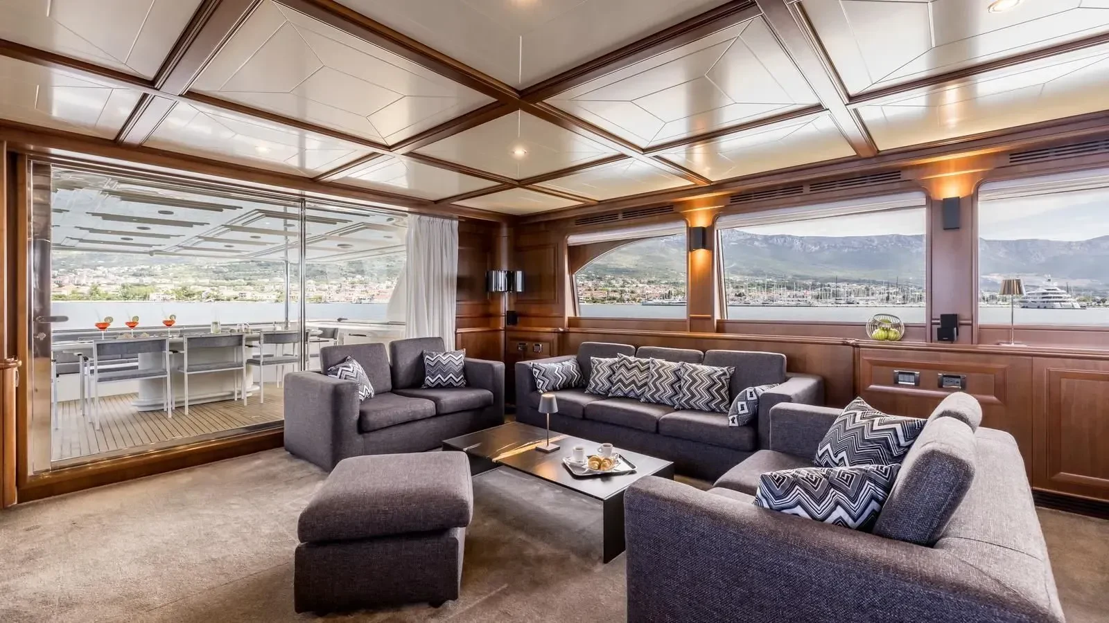 a living room with a large window aboard KLOBUK Yacht for Charter