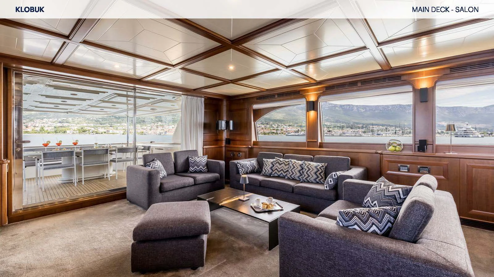 a living room with a large window aboard KLOBUK Yacht for Charter