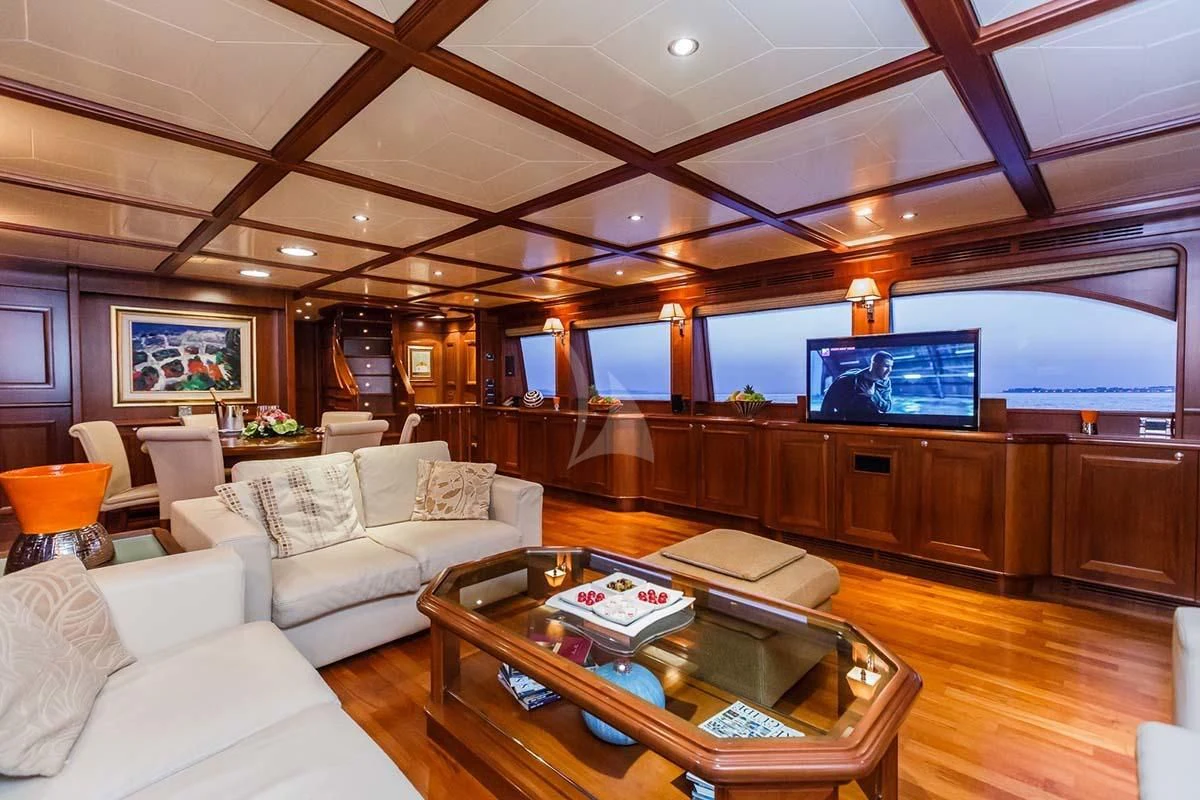 a living room with a large tv aboard KLOBUK Yacht for Charter