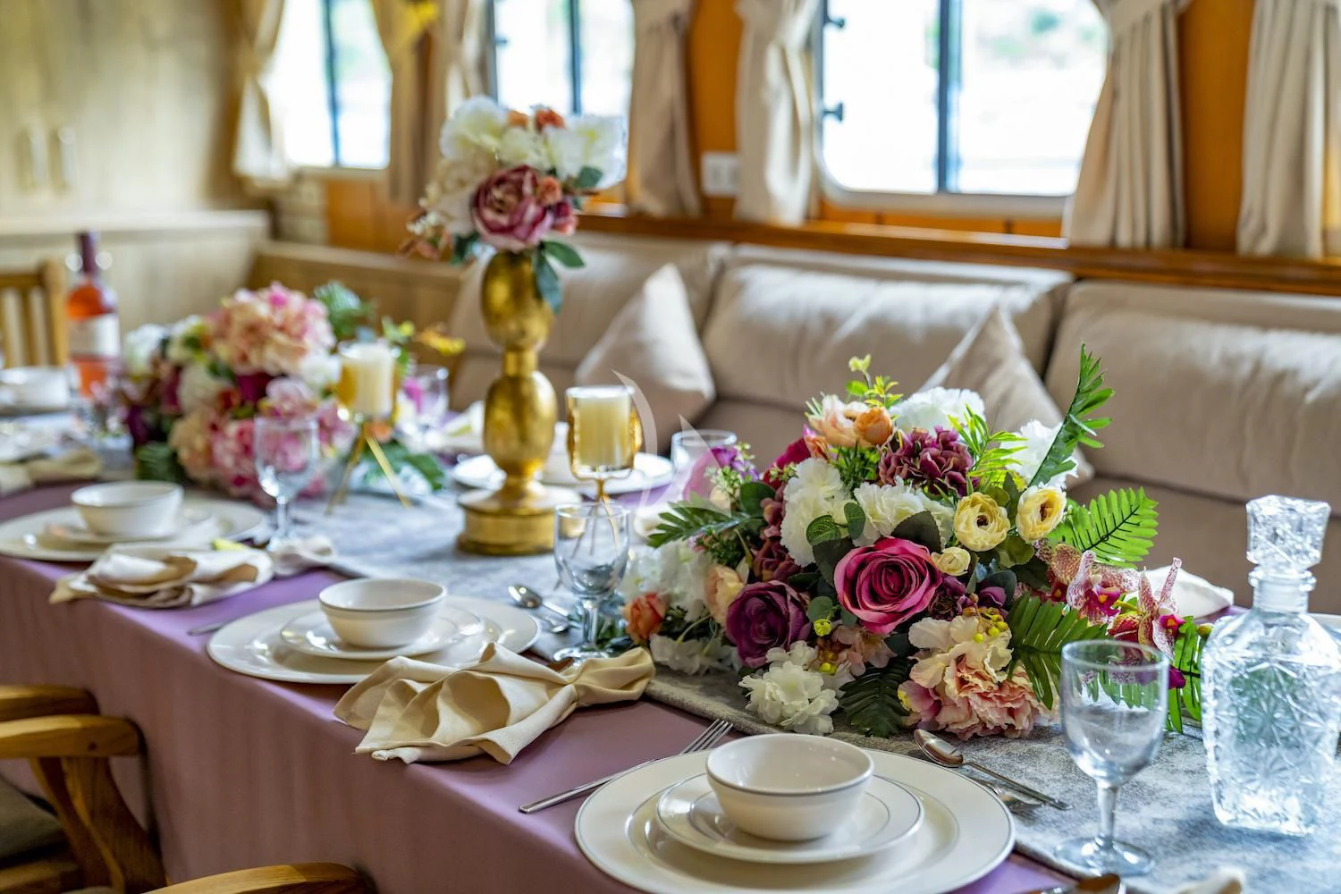 a table with flowers and candles aboard TERSANE 8 Yacht for Sale