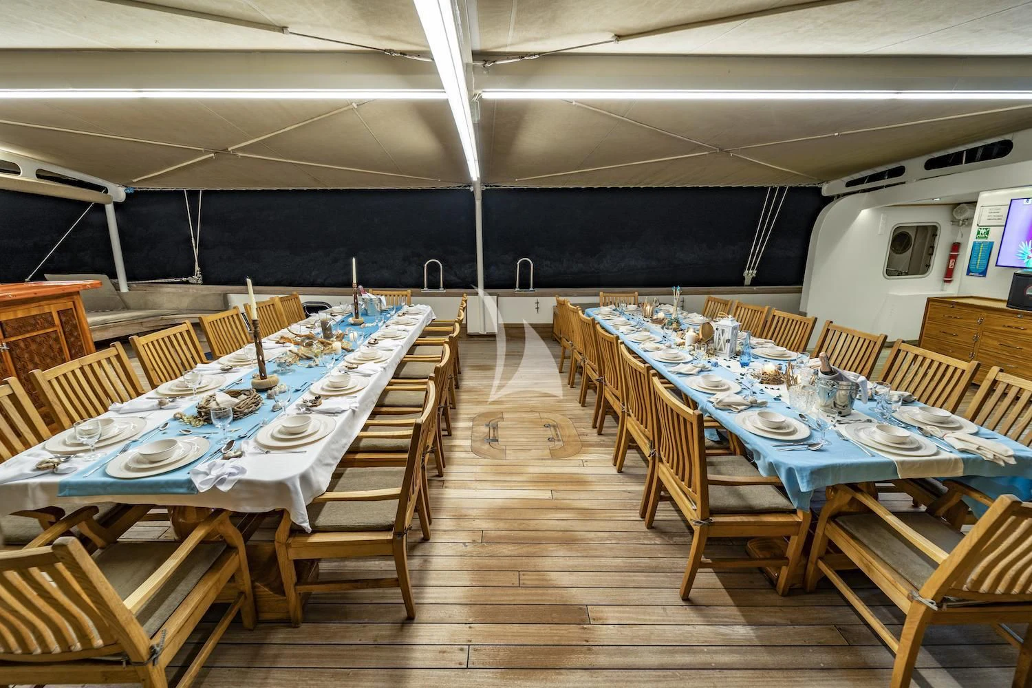 a room with tables and chairs aboard TERSANE 8 Yacht for Sale