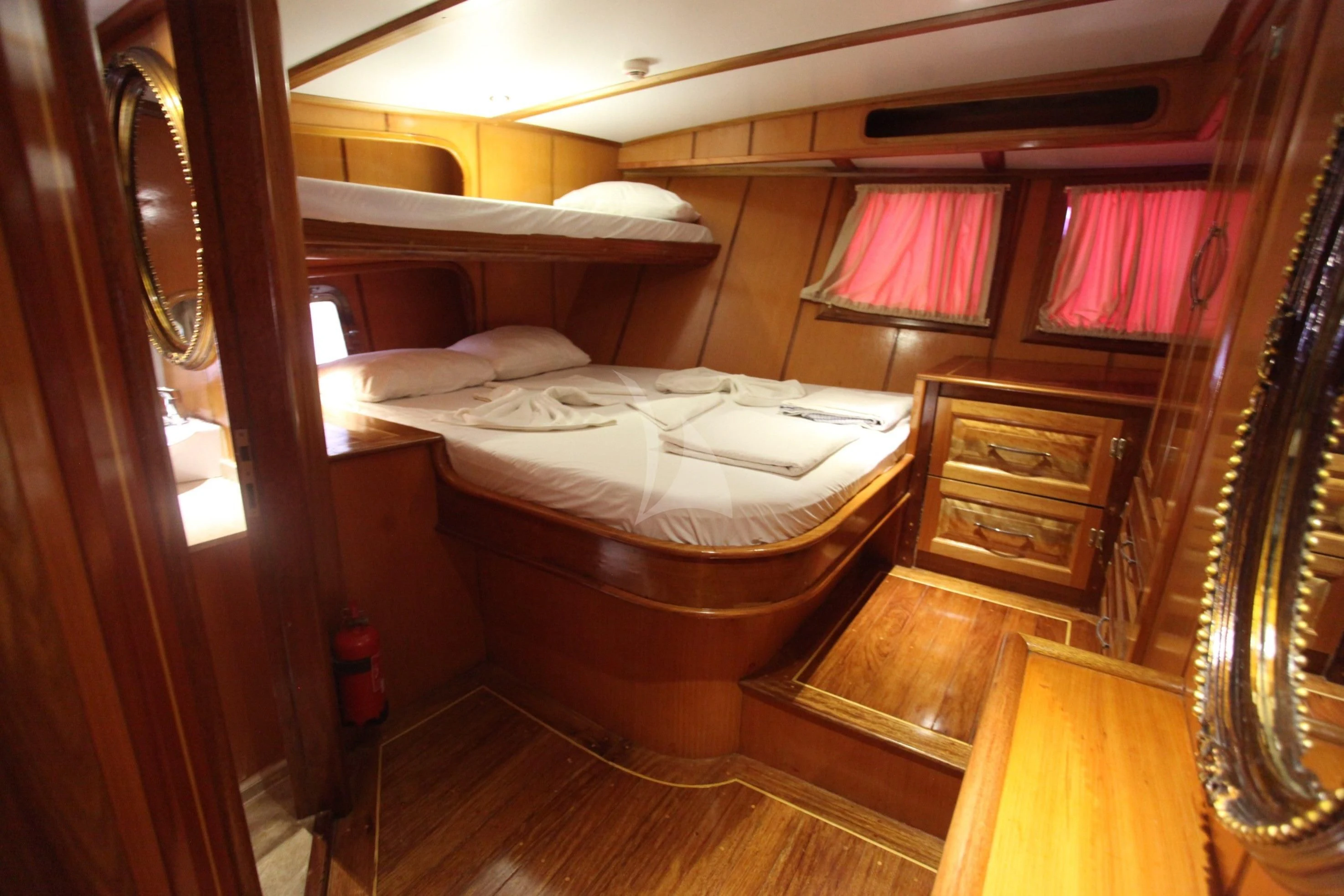 a bedroom with a bed and a mirror aboard TERSANE 8 Yacht for Sale