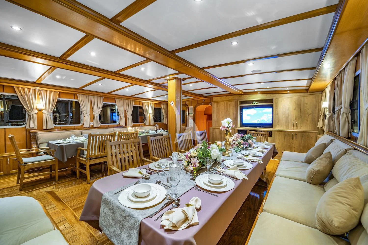 a dining room with a table set aboard TERSANE 8 Yacht for Sale