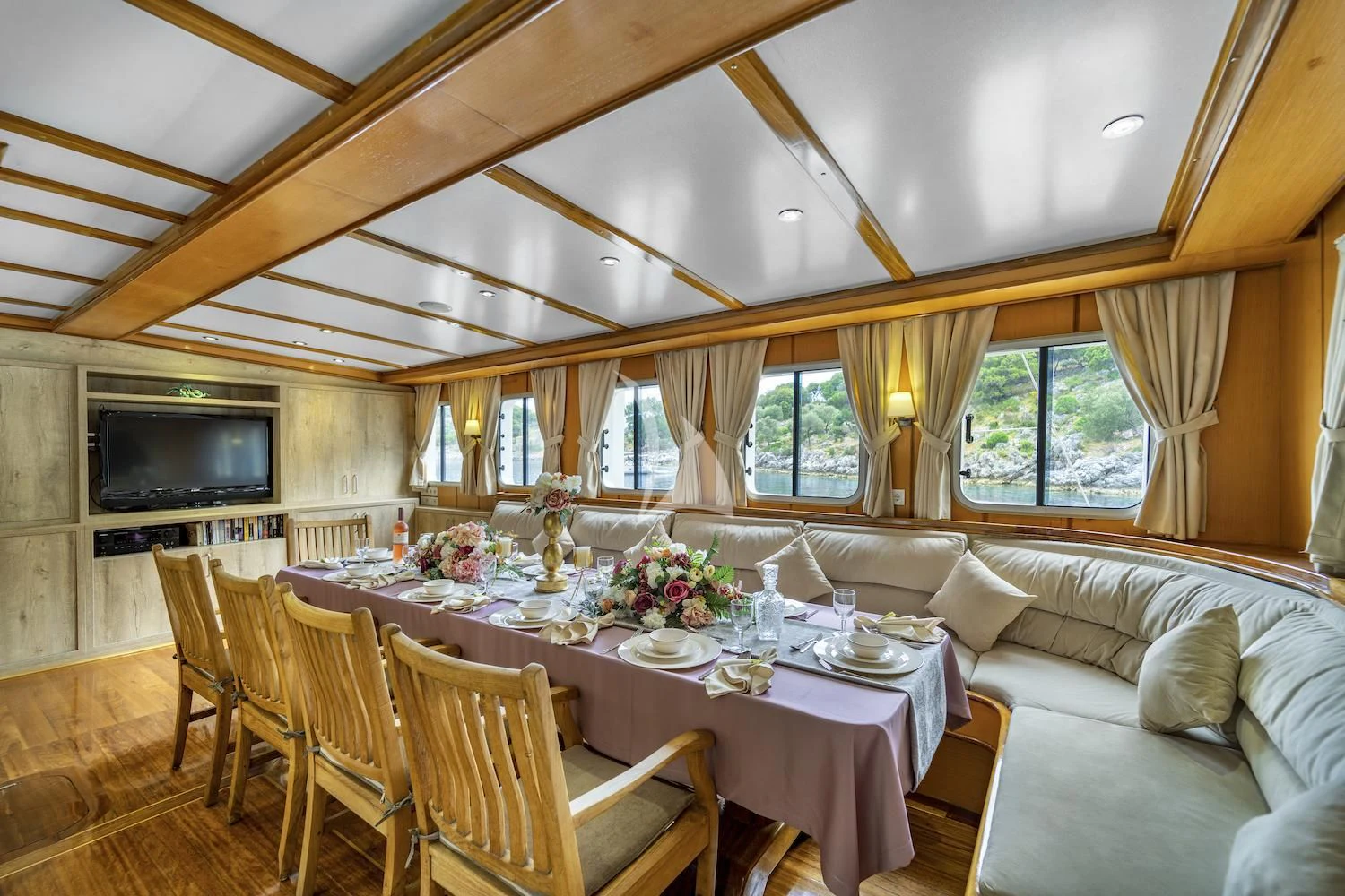 a dining table in a living room aboard TERSANE 8 Yacht for Sale