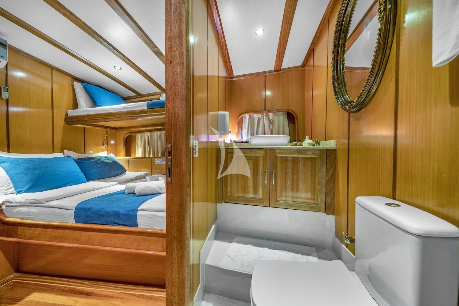 a room with a bed and a mirror aboard TERSANE 8 Yacht for Sale