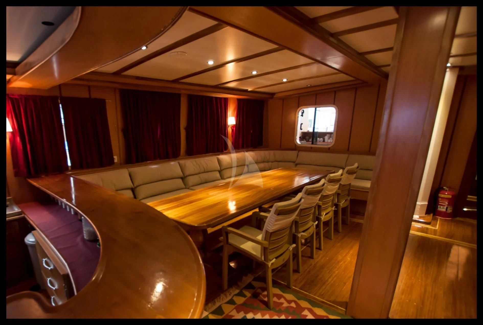 a room with a couch and a table and chairs aboard TERSANE 8 Yacht for Sale