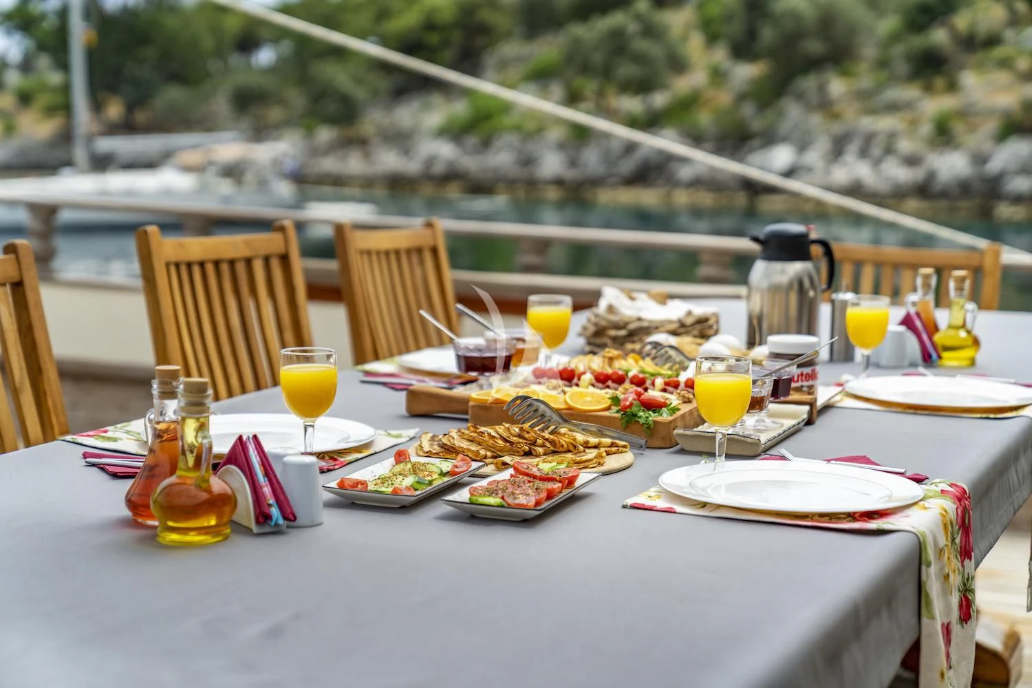 a table set with food and drinks aboard TERSANE 8 Yacht for Sale