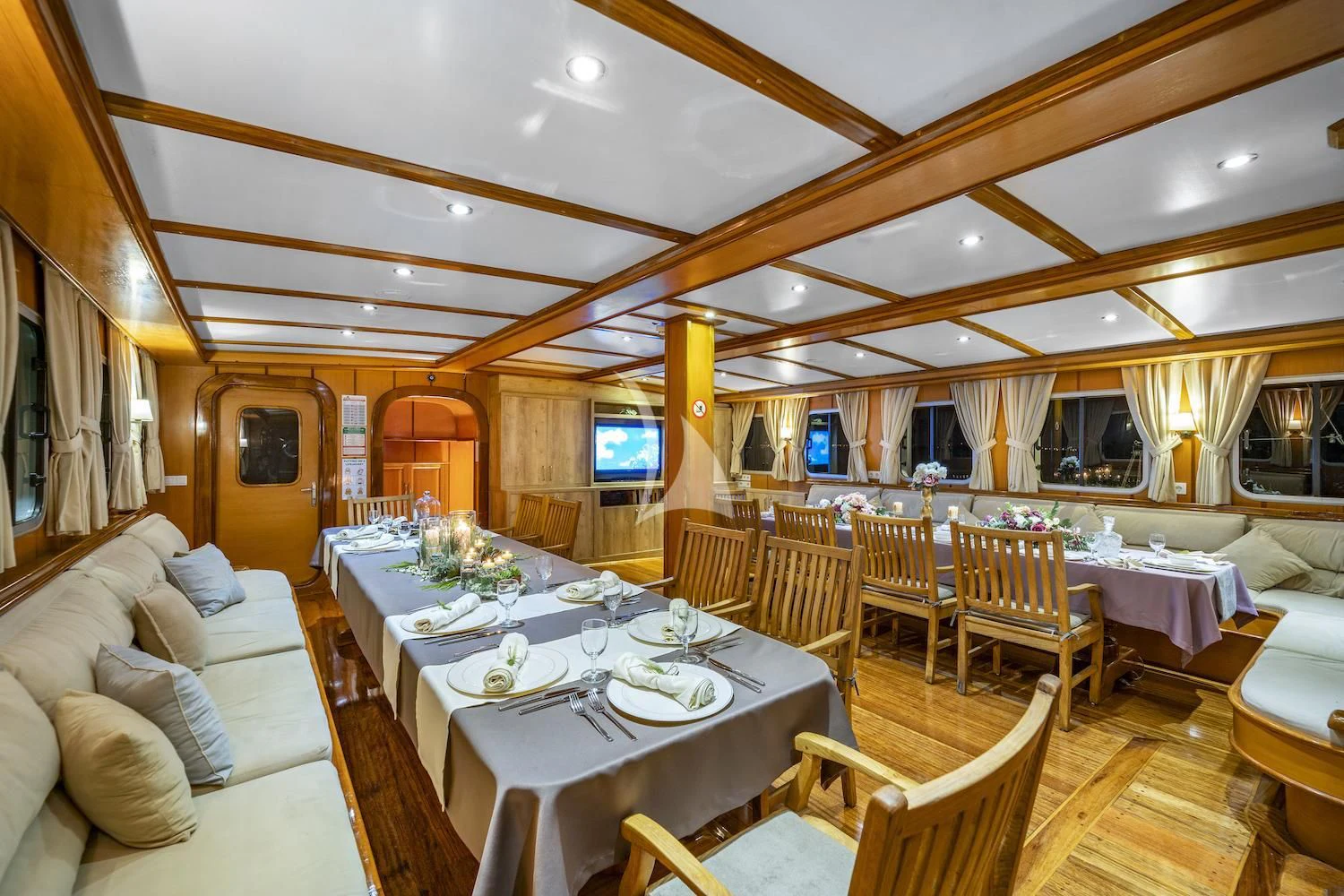 a large room with tables and chairs aboard TERSANE 8 Yacht for Sale