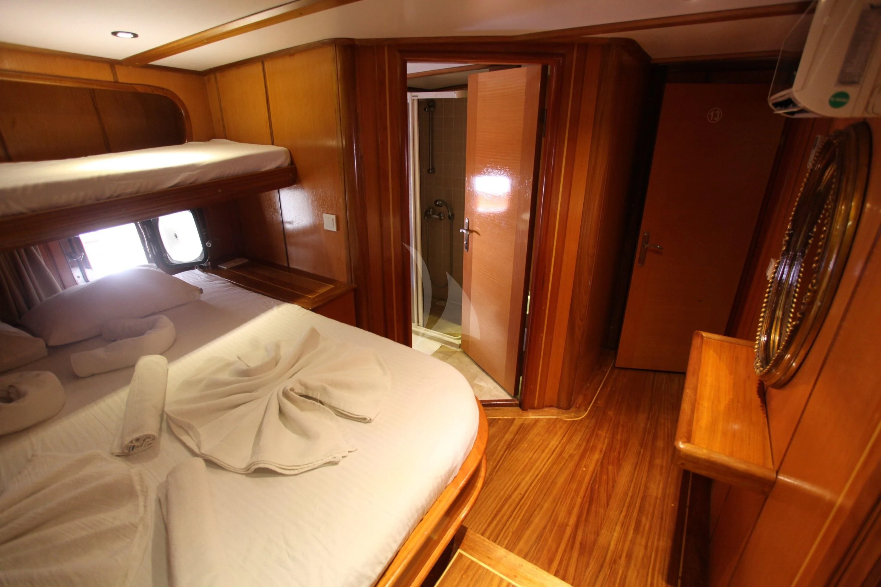 a room with a bed and a mirror aboard TERSANE 8 Yacht for Sale