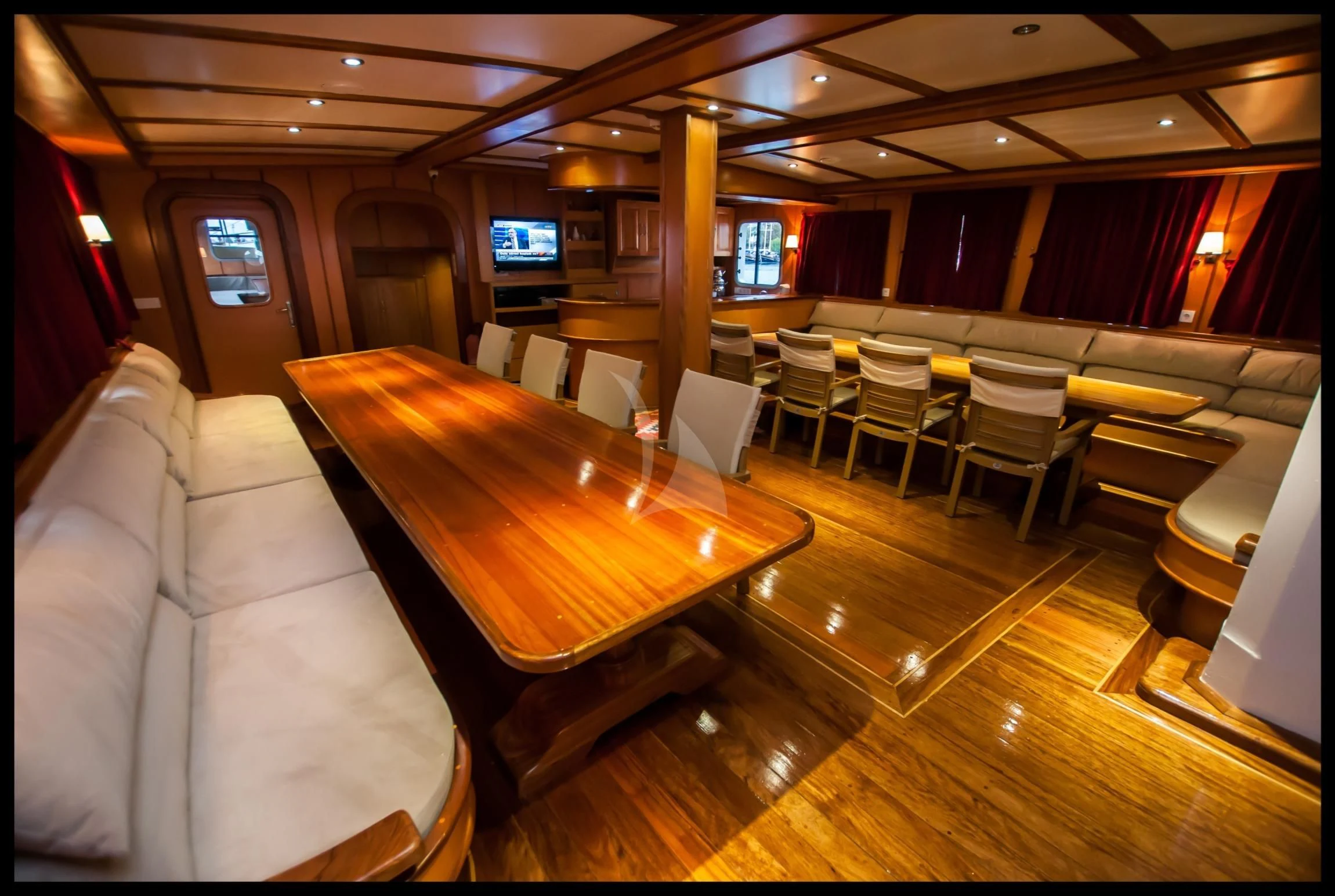 a large room with a table and chairs aboard TERSANE 8 Yacht for Sale