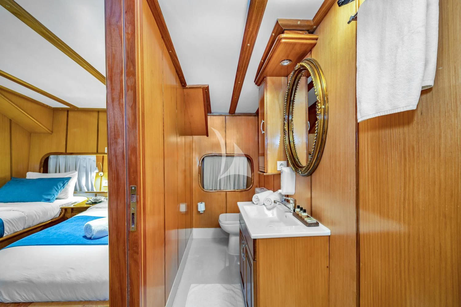 a bathroom with a mirror and a bed aboard TERSANE 8 Yacht for Sale