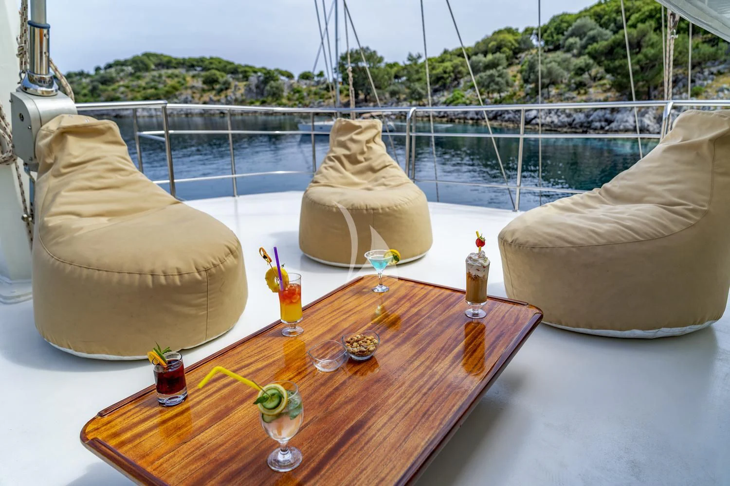 a table with a table with a couple of candles and a large white object on it aboard TERSANE 8 Yacht for Sale