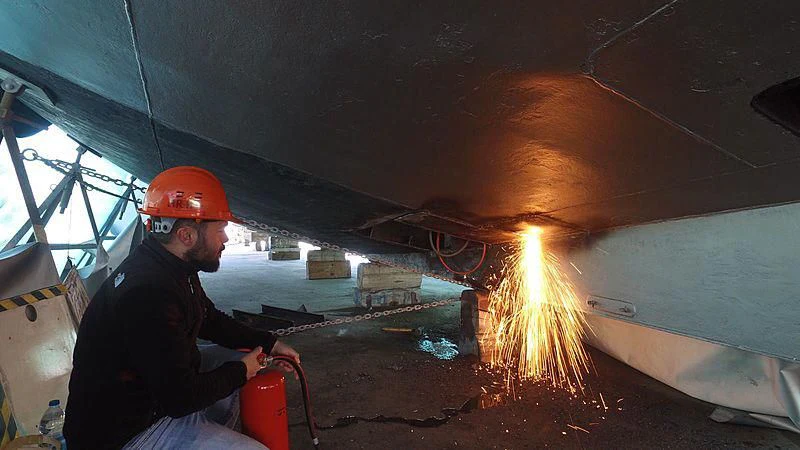a man in a helmet in a tunnel aboard BLUE SCORPION Yacht for Sale
