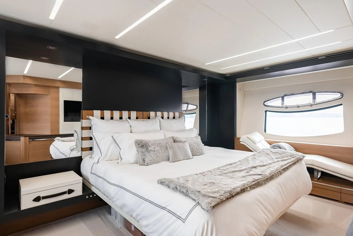 a room with a bed and a desk aboard TINE V Yacht for Sale