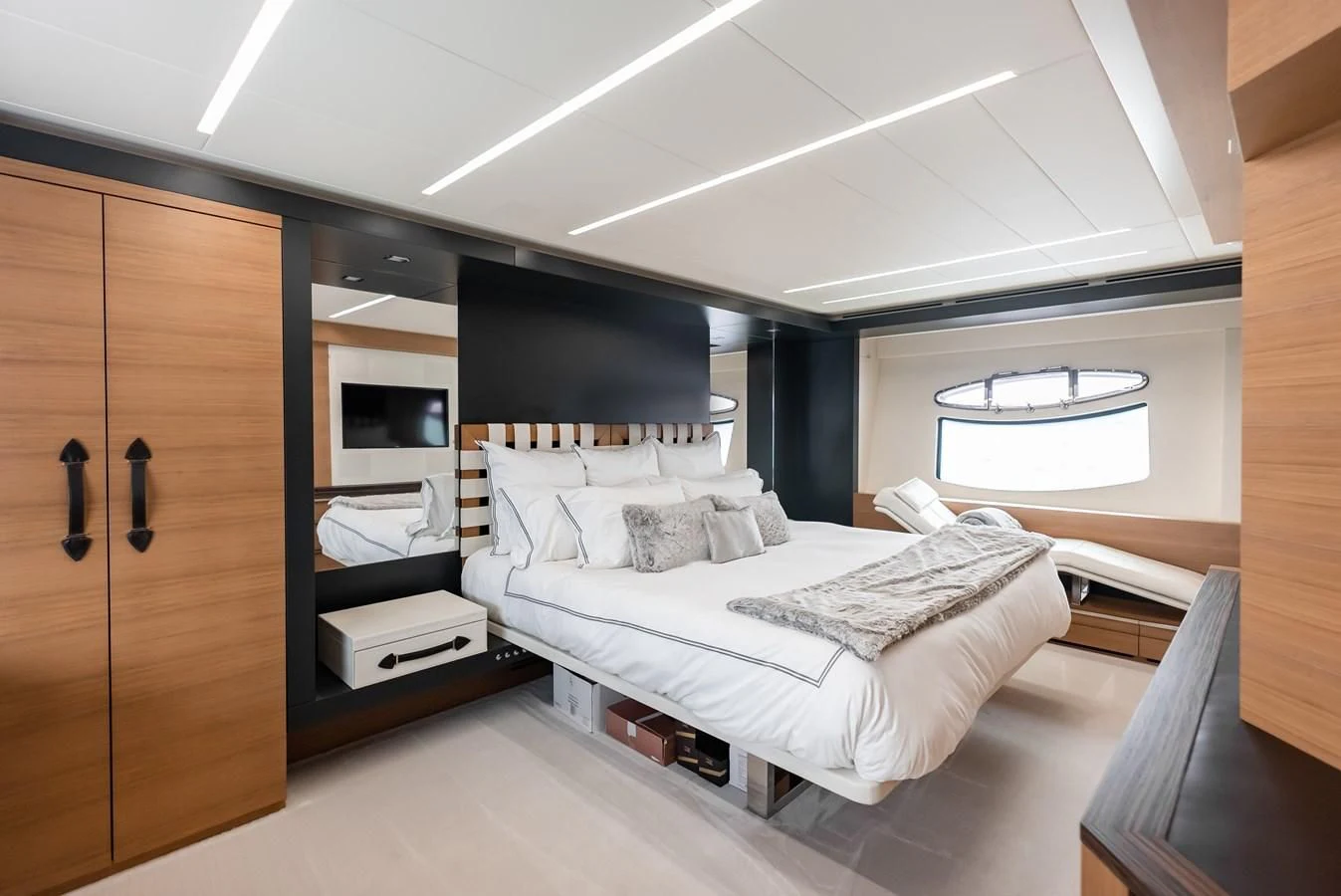 a room with a bed and a desk aboard TINE V Yacht for Sale