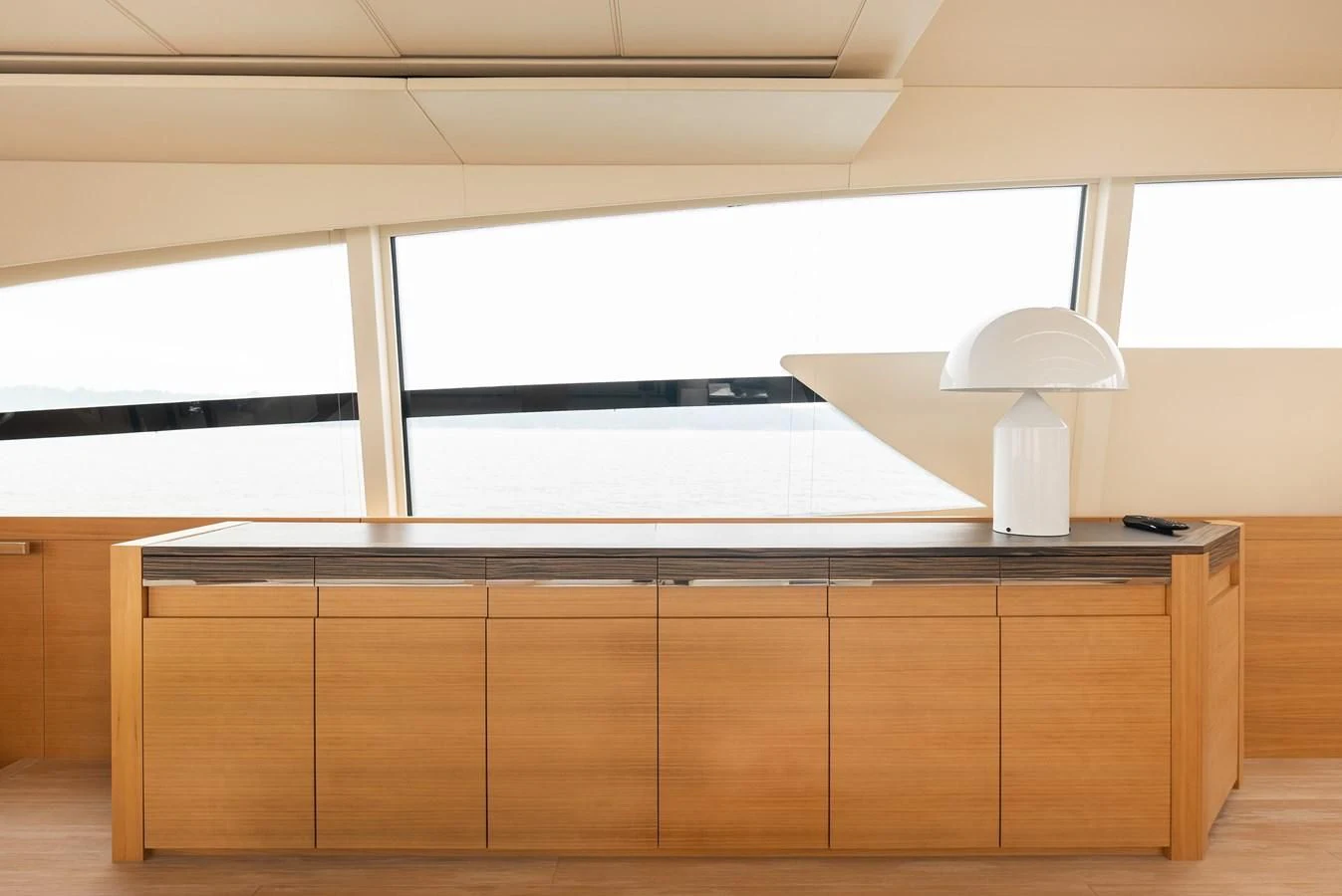 a room with a desk and a lamp aboard TINE V Yacht for Sale