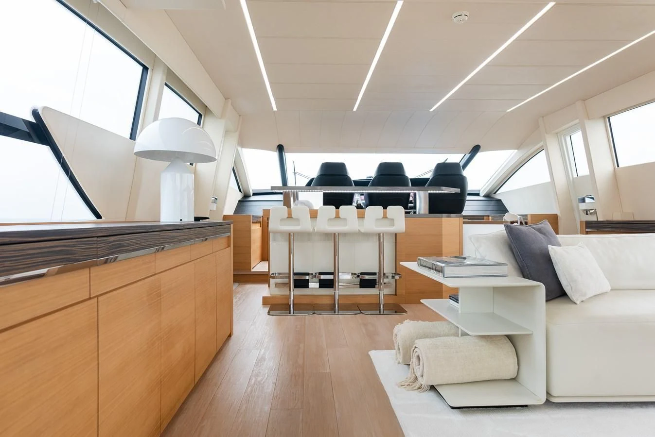 a room with a couch and a table and chairs aboard TINE V Yacht for Sale