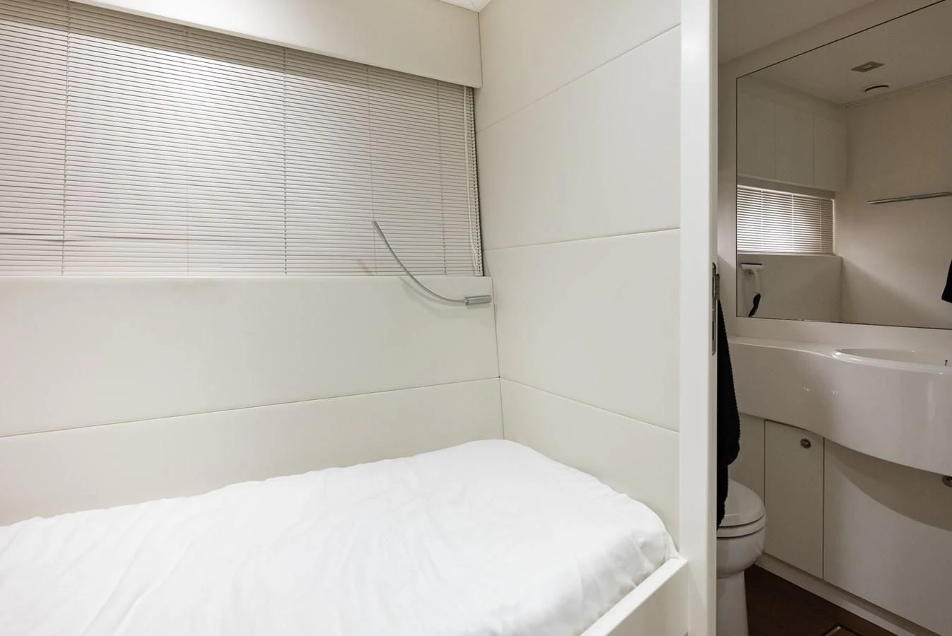 a bathroom with a tub sink and toilet aboard TINE V Yacht for Sale