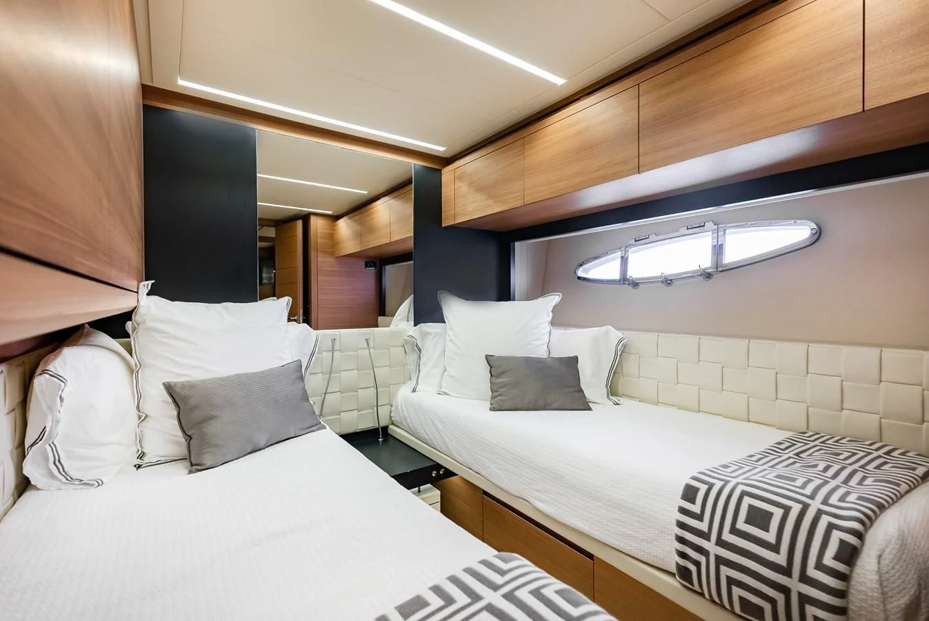 a room with two beds aboard TINE V Yacht for Sale