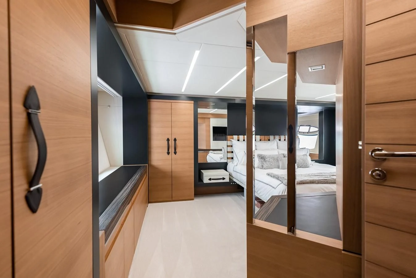 a room with a bed and a closet aboard TINE V Yacht for Sale