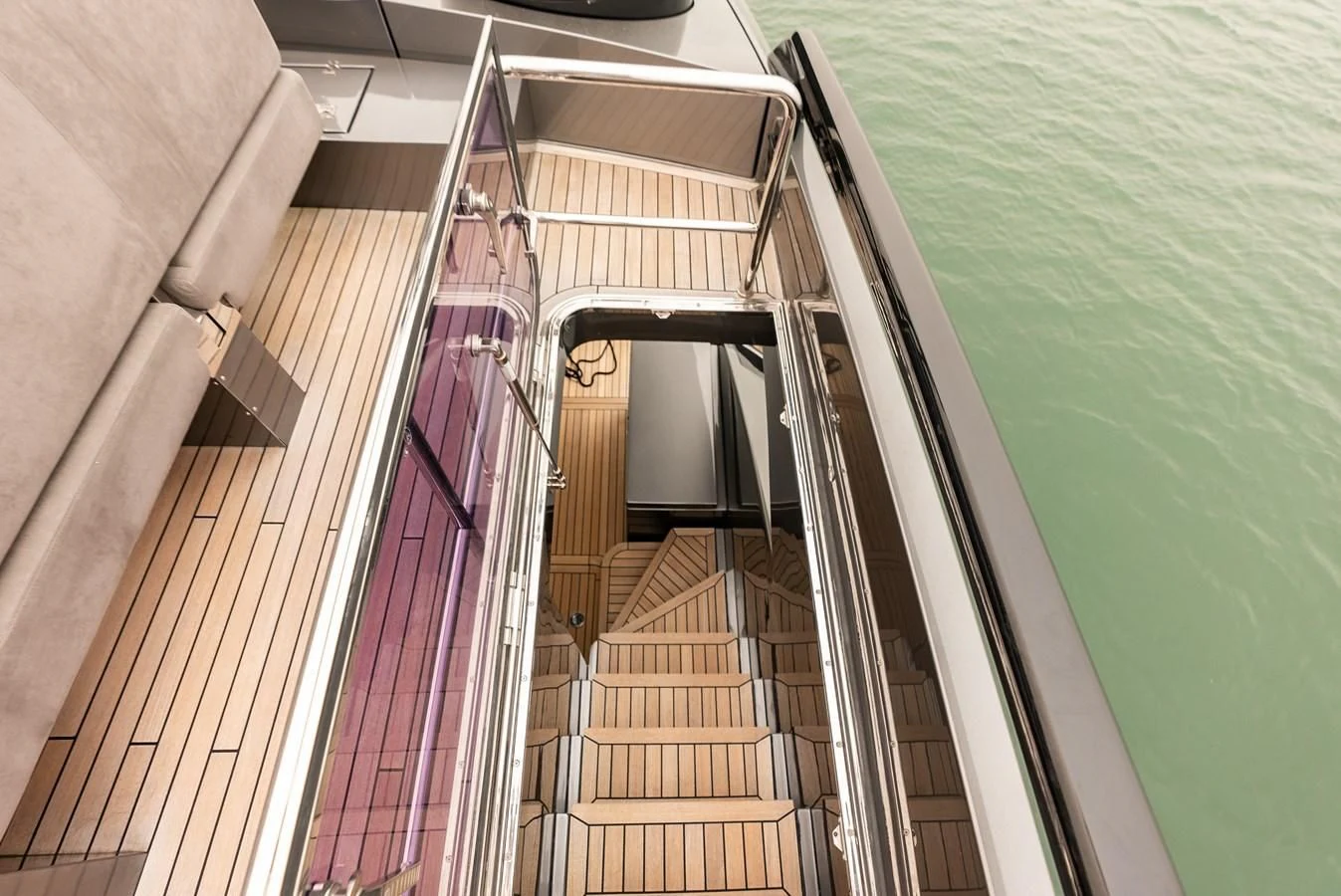 a staircase with a railing and a pool of water aboard TINE V Yacht for Sale