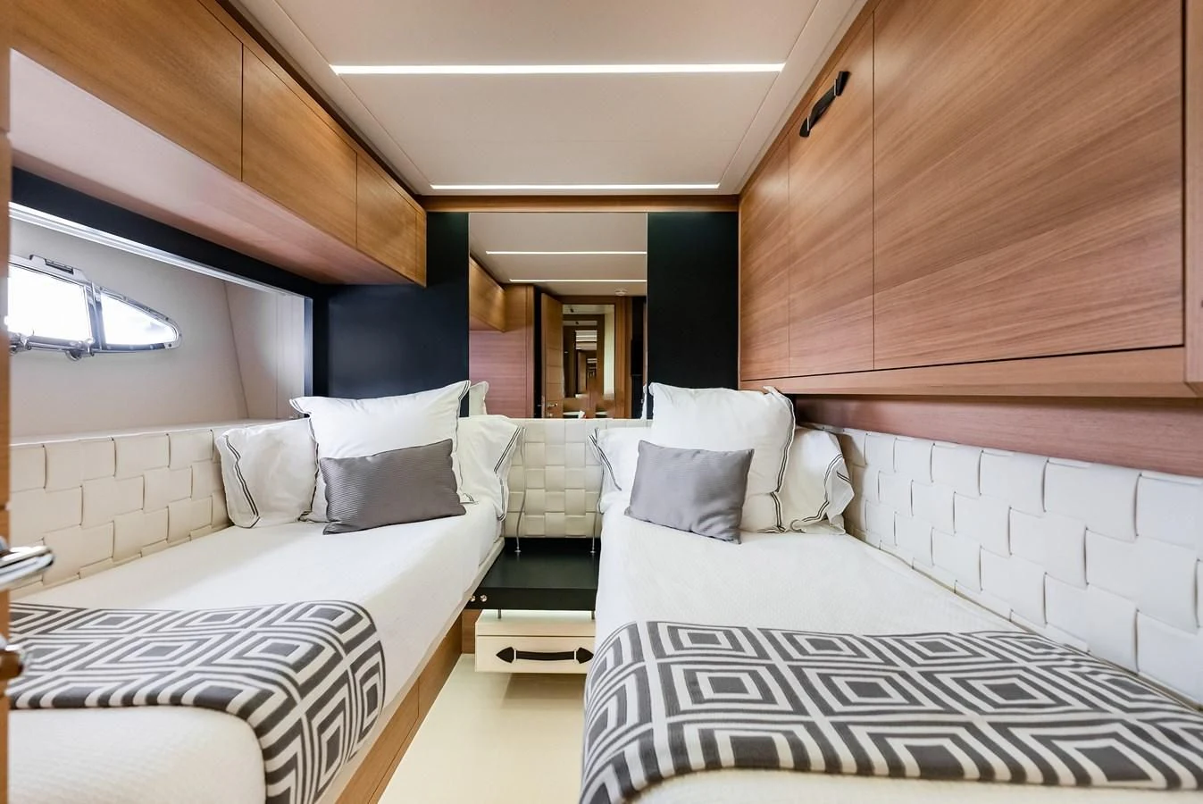 a room with a couple of beds aboard TINE V Yacht for Sale