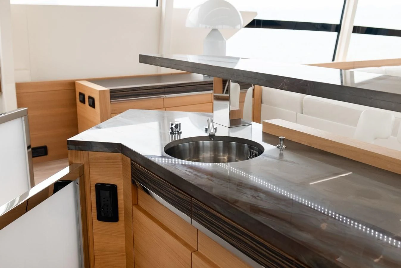 a kitchen with a sink and a large mirror aboard TINE V Yacht for Sale