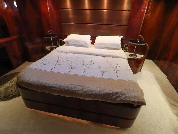 a bed with white sheets aboard MAX & ALE Yacht for Sale