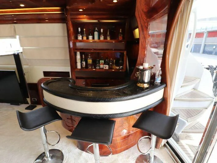 a barbeque grill with a table and chairs aboard MAX & ALE Yacht for Sale