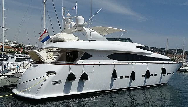 a white yacht in a harbor aboard MAX & ALE Yacht for Sale