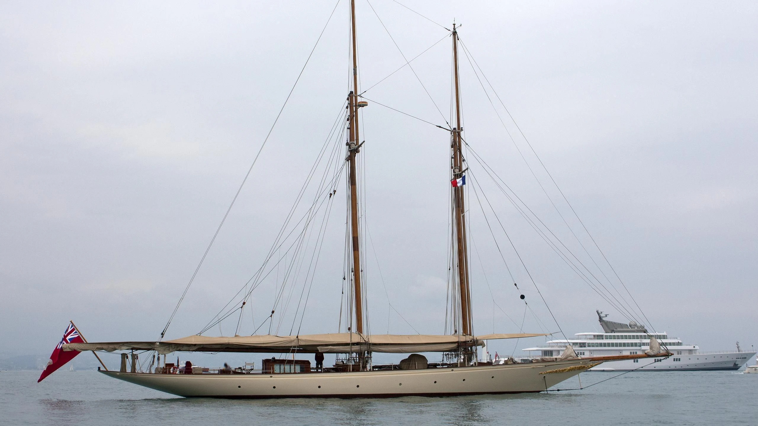 a boat with a flag on it aboard SUNSHINE Yacht for Sale