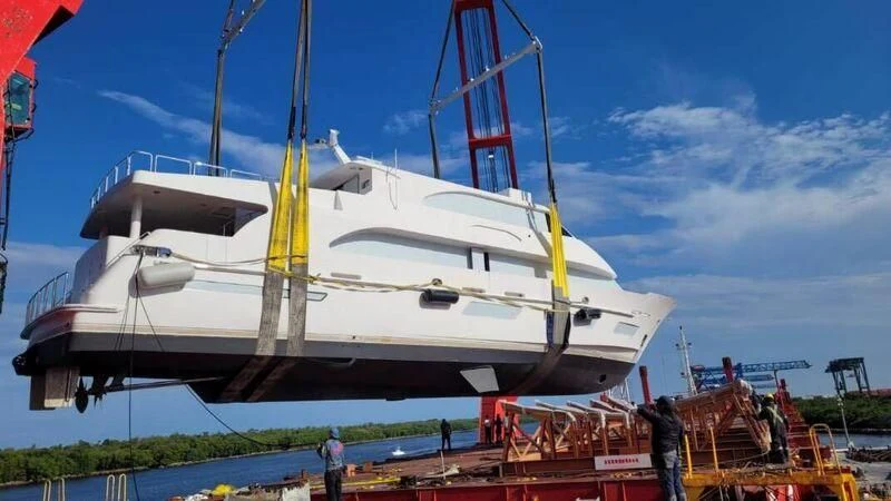 a large white boat aboard OBSESSION Yacht for Sale