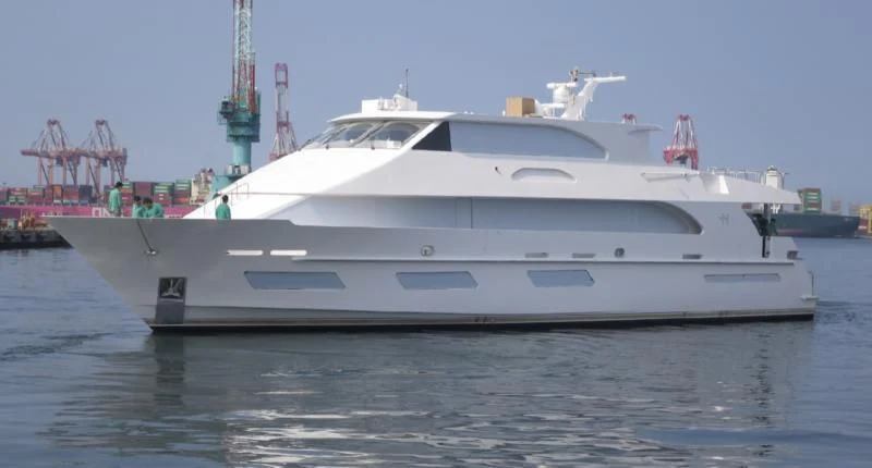 a white yacht on the water aboard OBSESSION Yacht for Sale