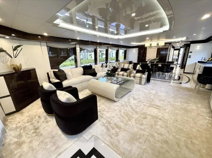 a large room with a large white and black floor aboard OBSESSION Yacht for Sale
