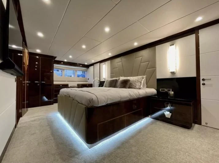 a bed in a room aboard OBSESSION Yacht for Sale