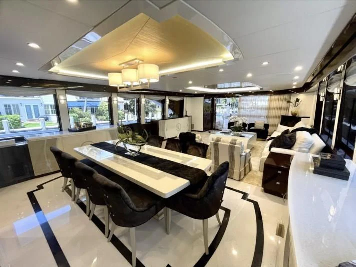 a room with a table and chairs aboard OBSESSION Yacht for Sale