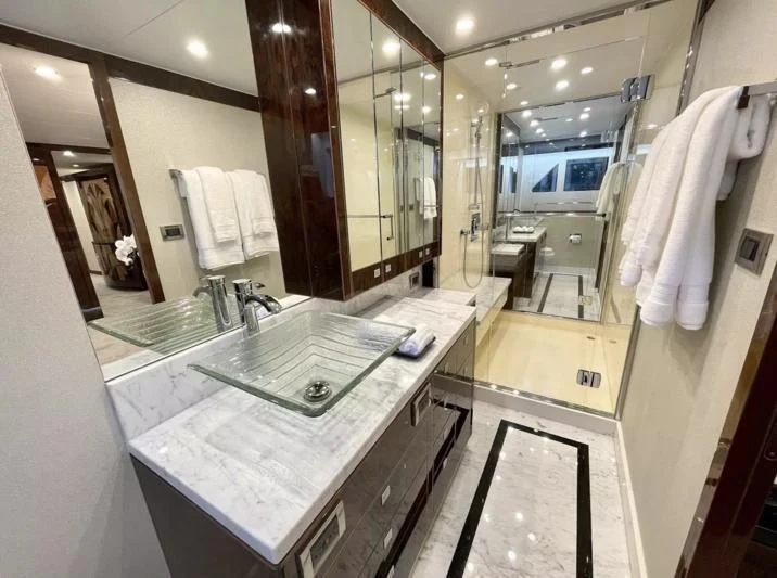 a bathroom with a large mirror aboard OBSESSION Yacht for Sale