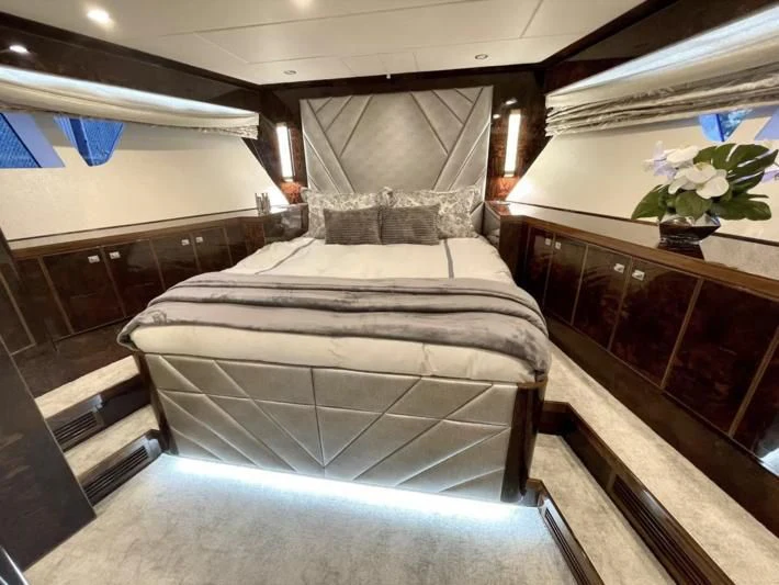 a bed in a room aboard OBSESSION Yacht for Sale
