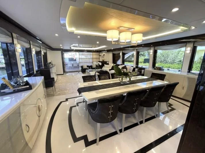 a room with a table and chairs aboard OBSESSION Yacht for Sale