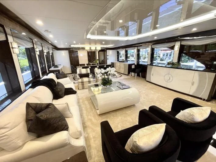 a living room with a large window aboard OBSESSION Yacht for Sale