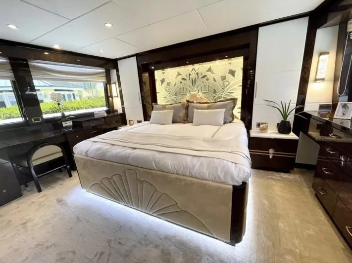 a large bed in a room aboard OBSESSION Yacht for Sale