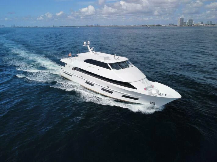 a white yacht in the water aboard OBSESSION Yacht for Sale