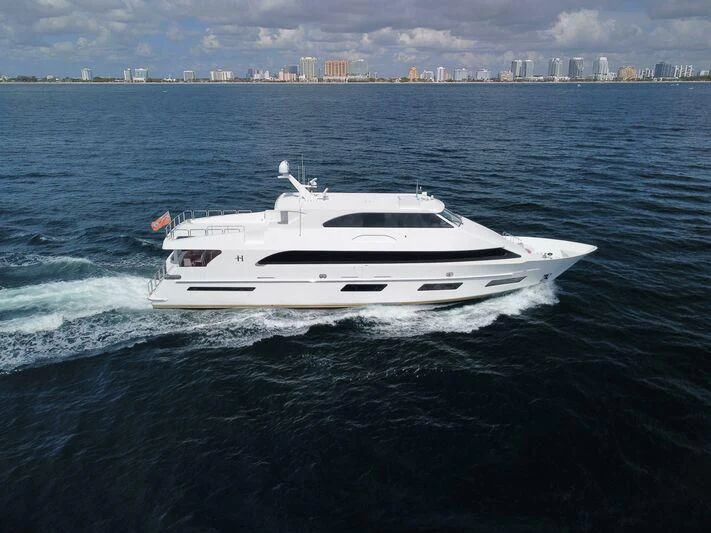 a white yacht in the water aboard OBSESSION Yacht for Sale