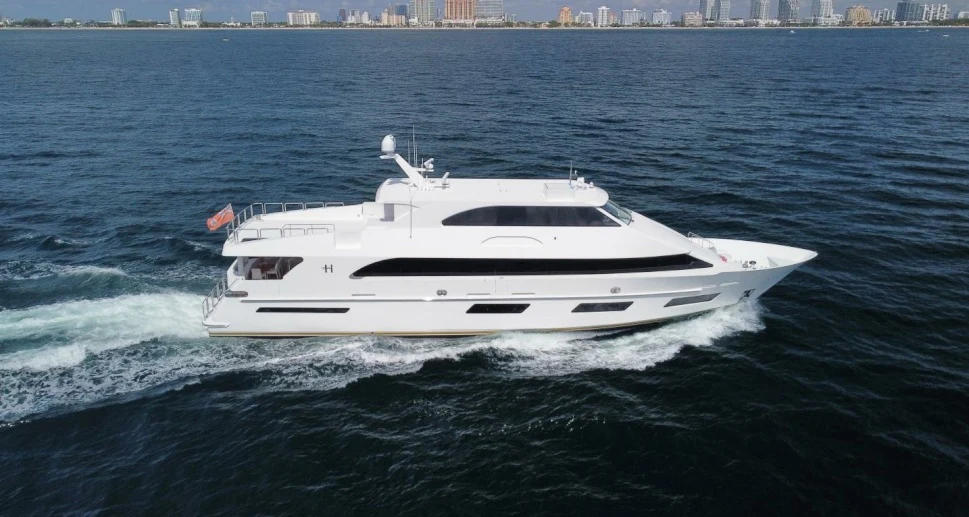 a white yacht in the water aboard OBSESSION Yacht for Sale